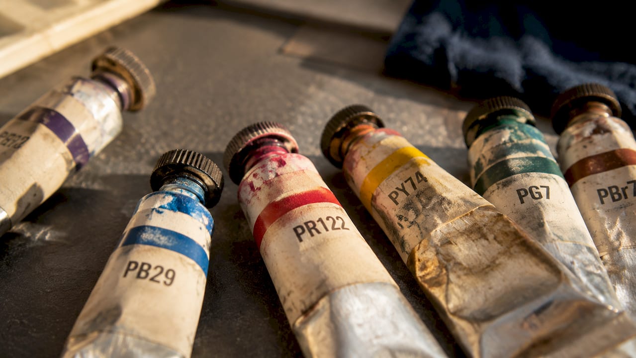 Close-up of paint tubes emphasizing pigment codes