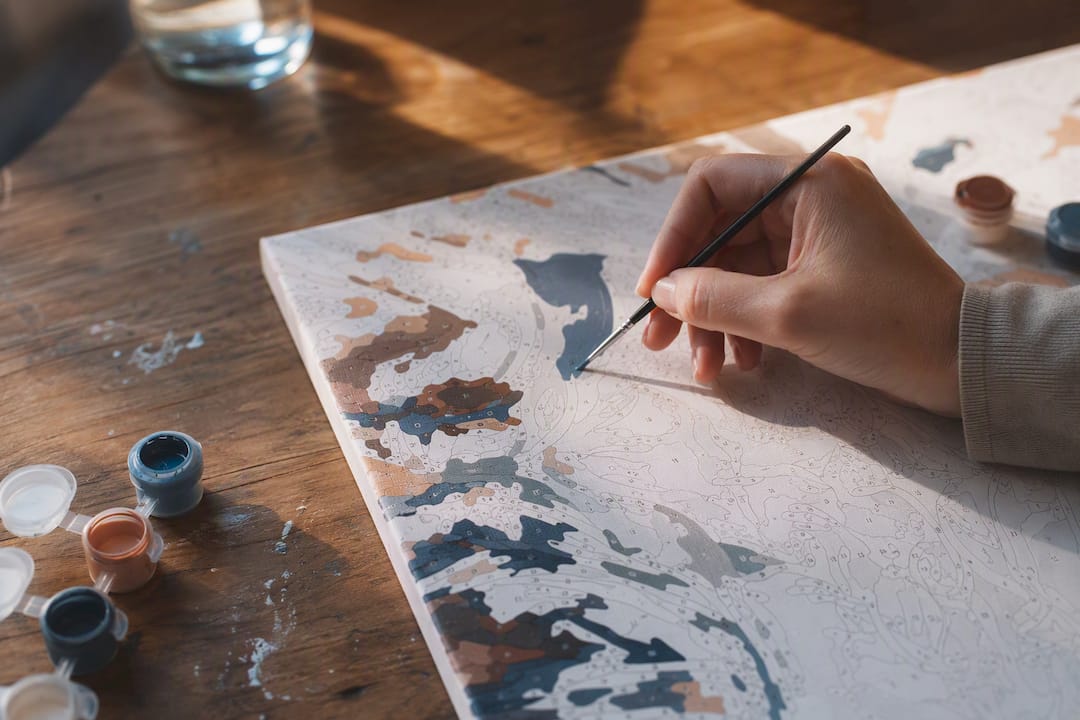 Close-up of brush painting sharp canvas section
