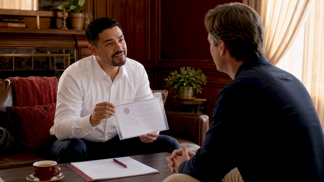 Contractor showing HIC registration certificate indoors