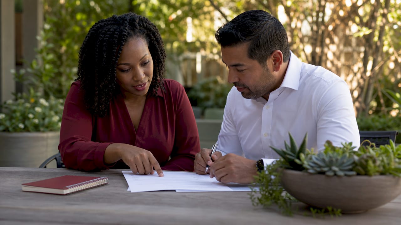 Two professionals discussing contract scope details