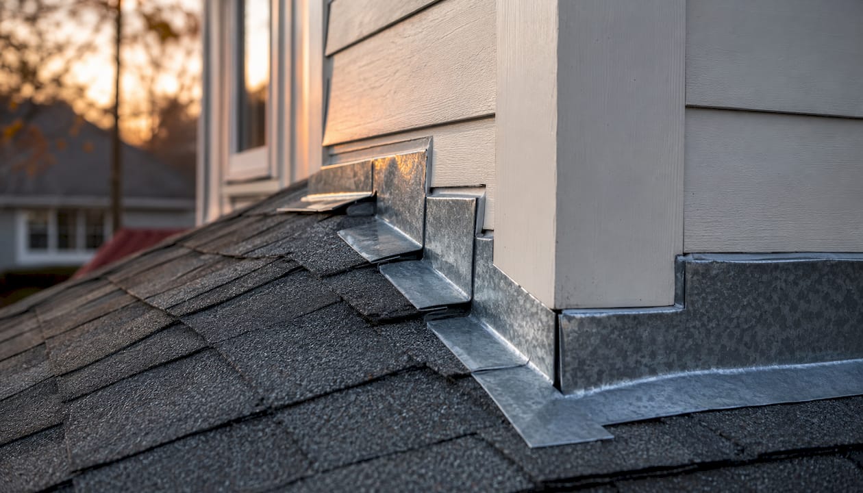 Close-up of step flashing between roof and wall
