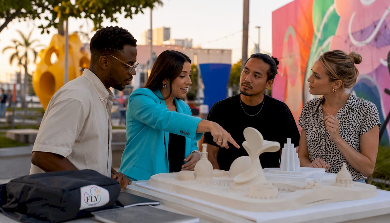 Diverse team discussing tactile sculpture model