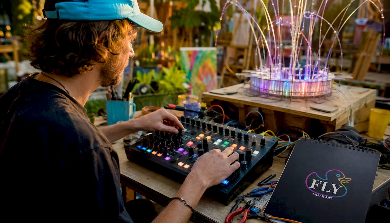 Artist adjusting interactive light controller panel