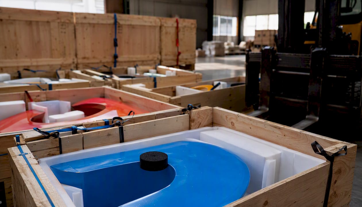 Packed modular sculpture sections in shipping crates