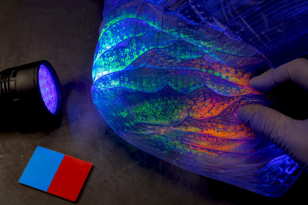 UV-reactive sculpture surface under blacklight