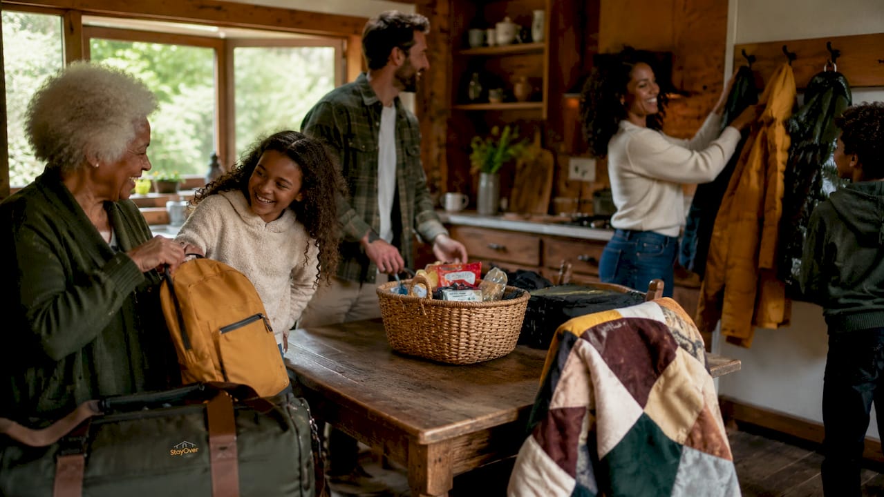 Family unpacking inside nature cabin