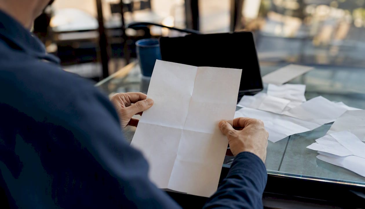 Hands investigating bank statement details