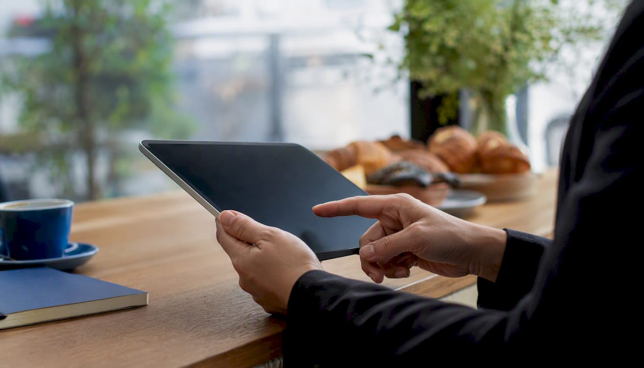 Hands entering customer info for credit control onboarding