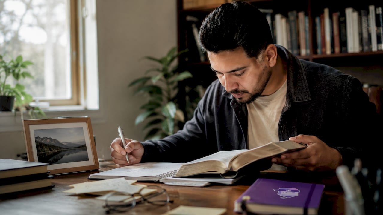 Pastor preparing spiritually with Bible and notes