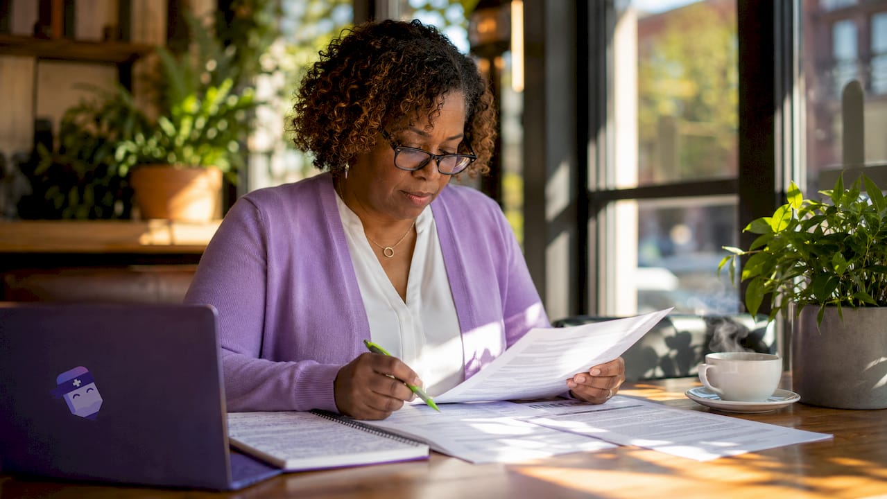 Ministry leader reviewing job descriptions at desk