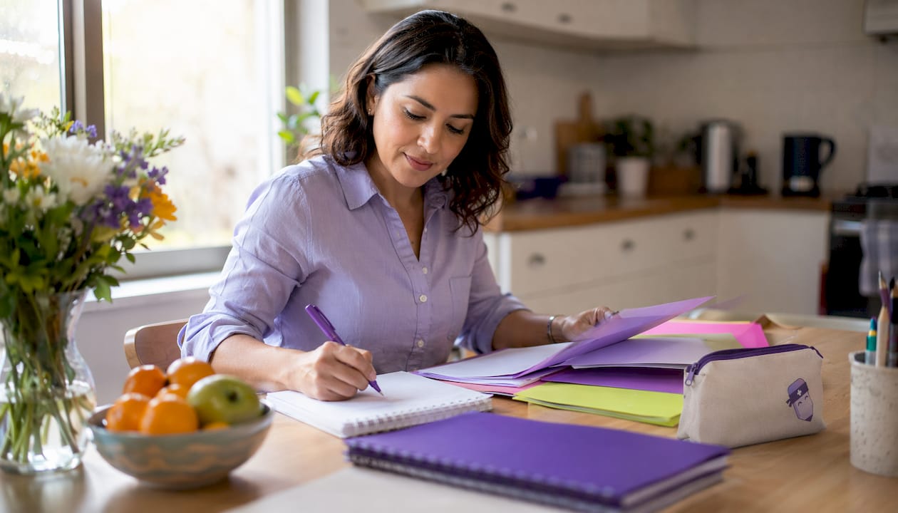 Church administrator preparing meeting agenda at desk
