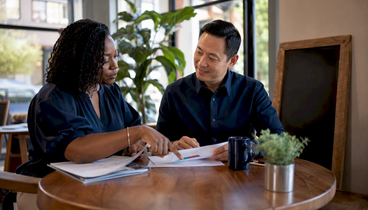 Mortgage advisors discussing loan options together