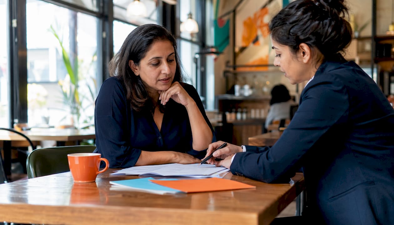 Client discussing mortgage underwriting issues with expert