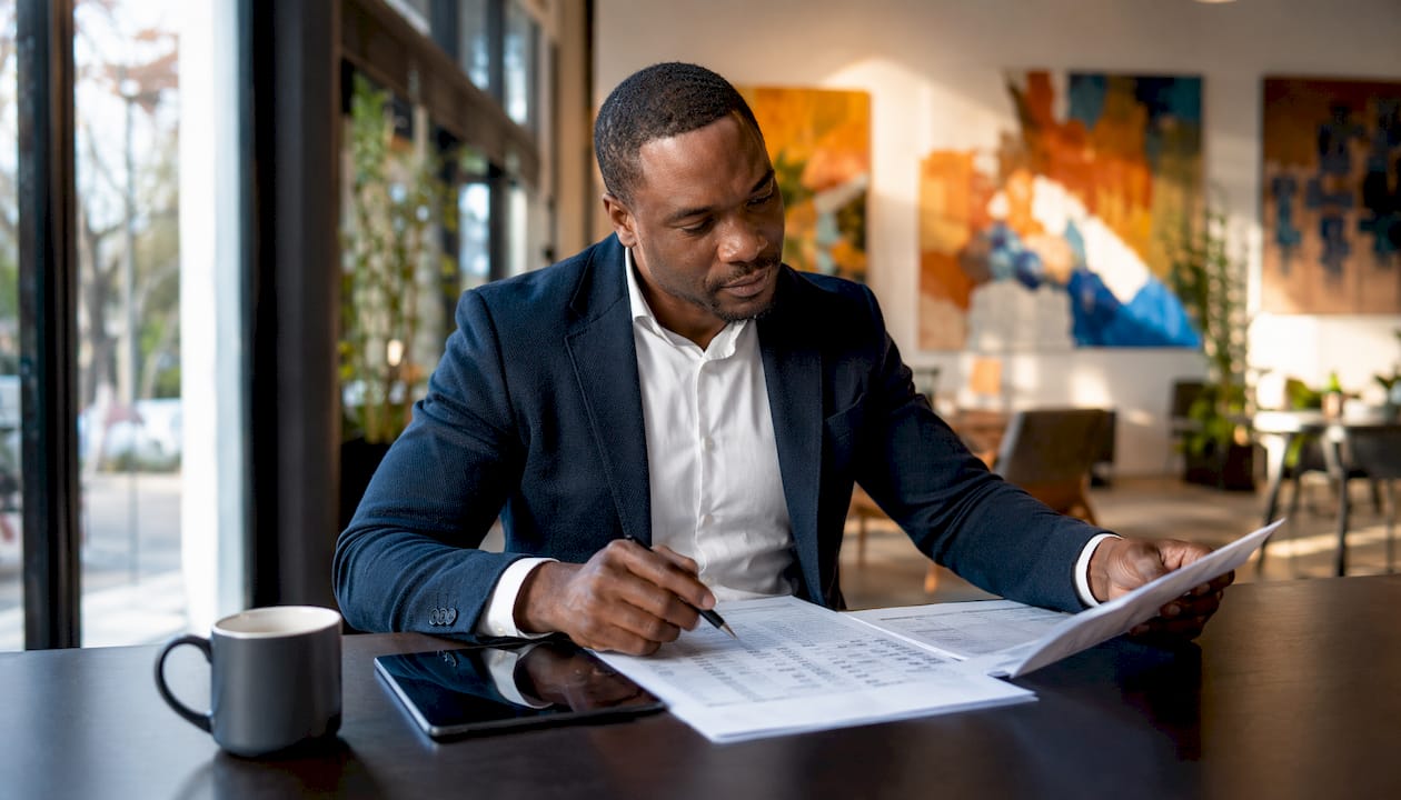 Financial advisor reviewing bank-statement loan papers