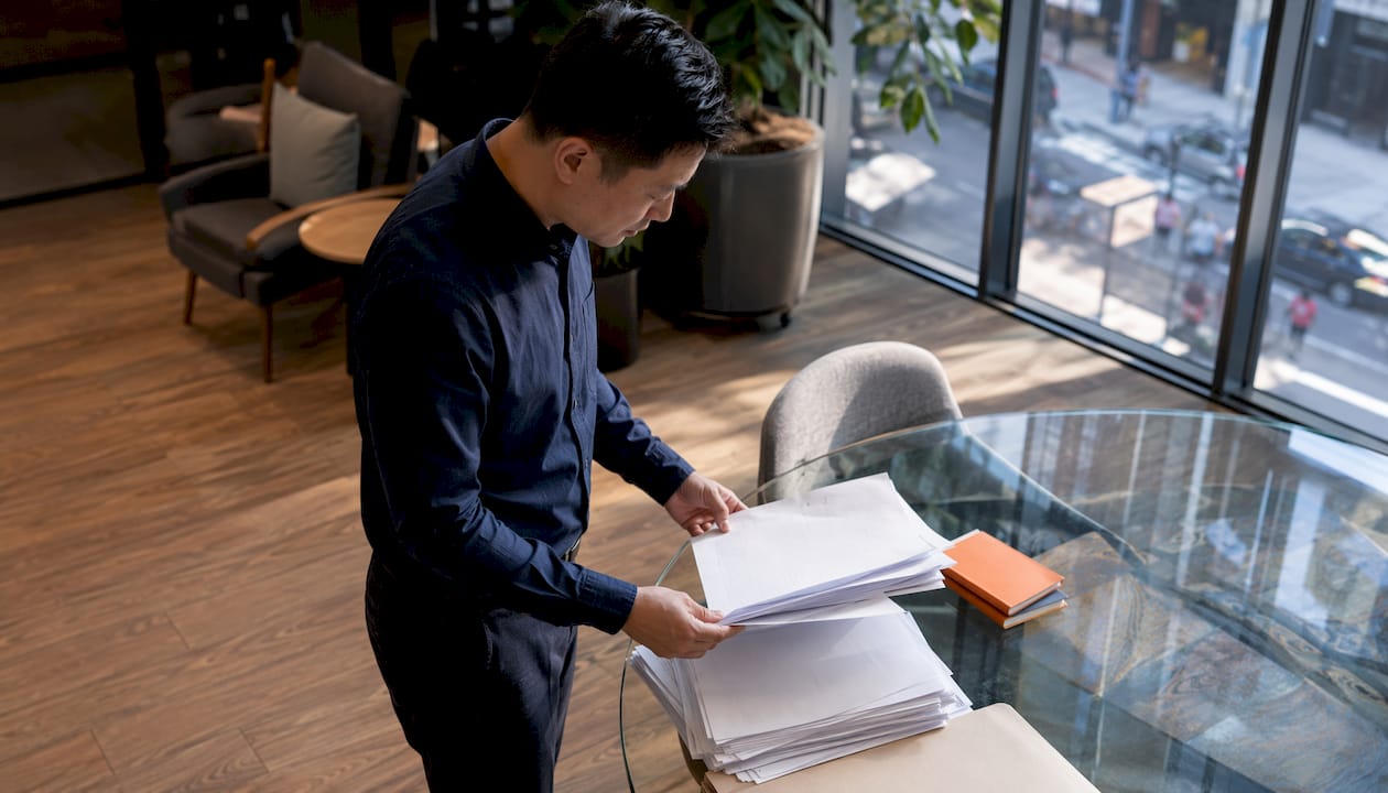 Loan underwriter reviewing mortgage documents