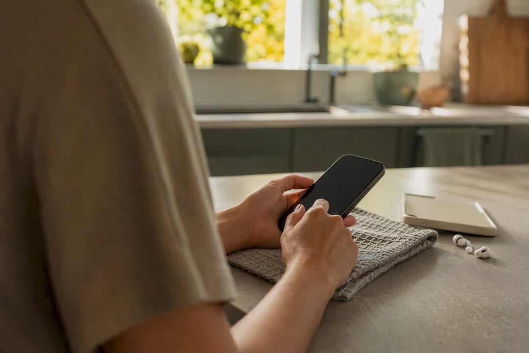 Hands holding a phone preparing to check backup