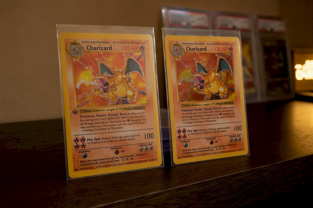 Comparison of 1st Edition and Unlimited Charizard cards