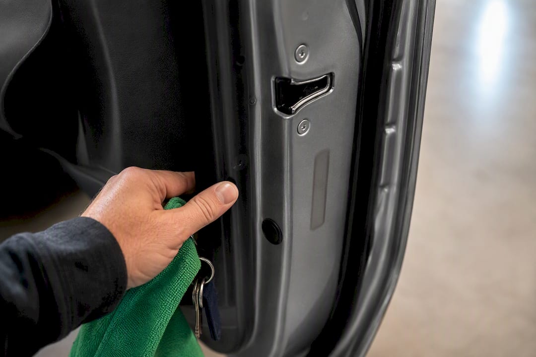 Dealer inspecting vehicle VIN plate