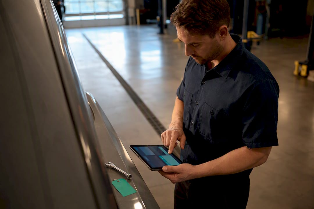 Dealer tracking vehicle costs on tablet