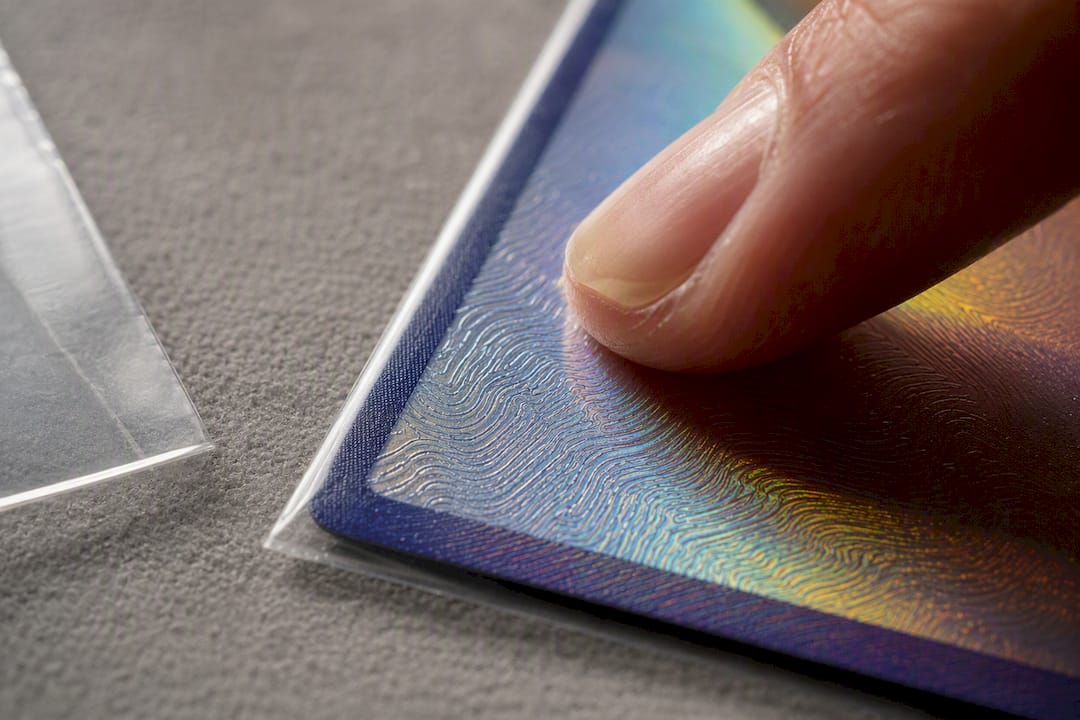Finger checking raised card surface texture