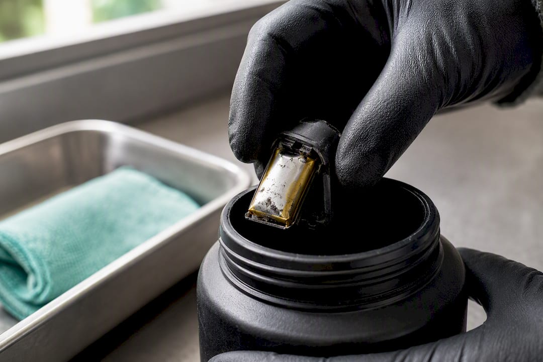 Damaged earbud battery at hazardous waste facility