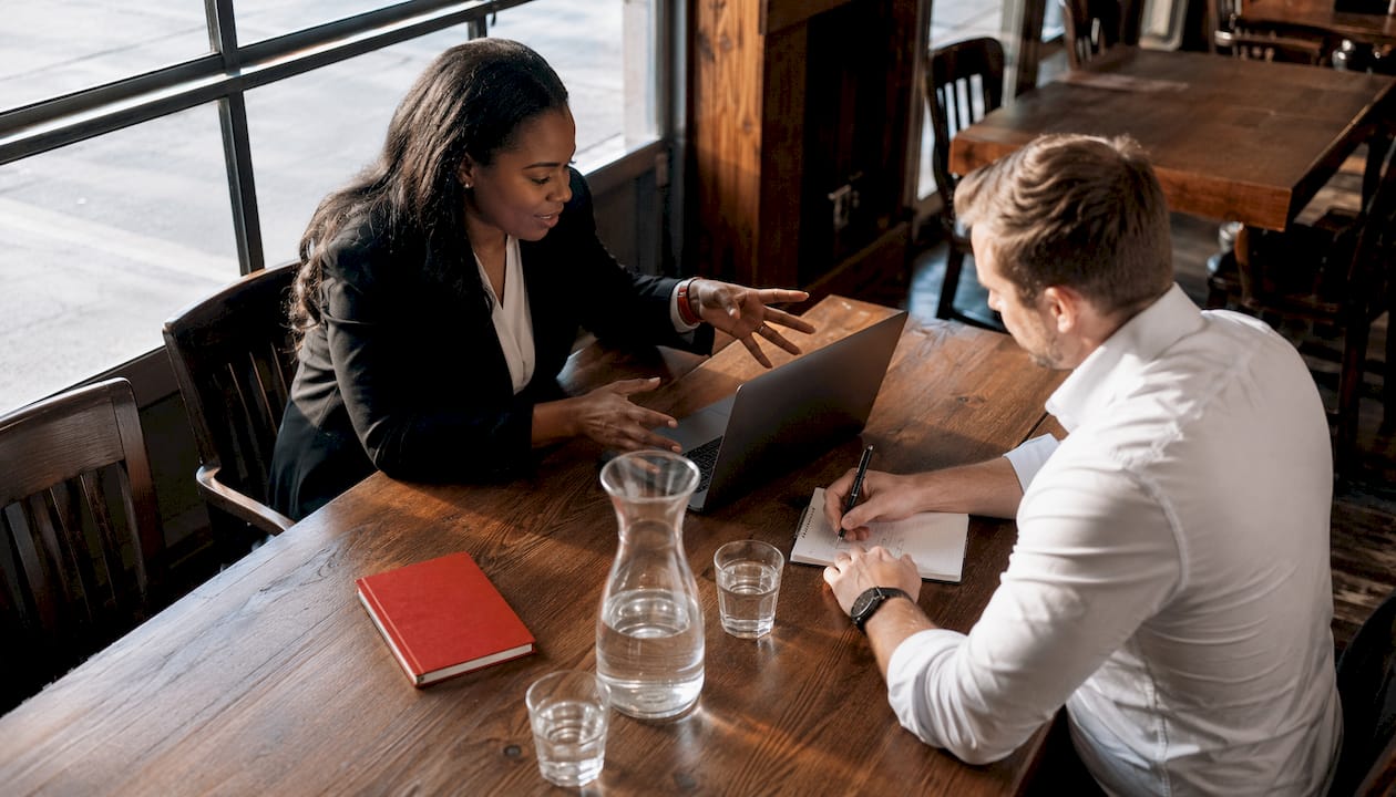 Lender and client discussing truck financing