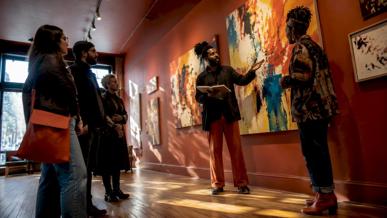 Artist and visitor in Baltimore Avenue gallery