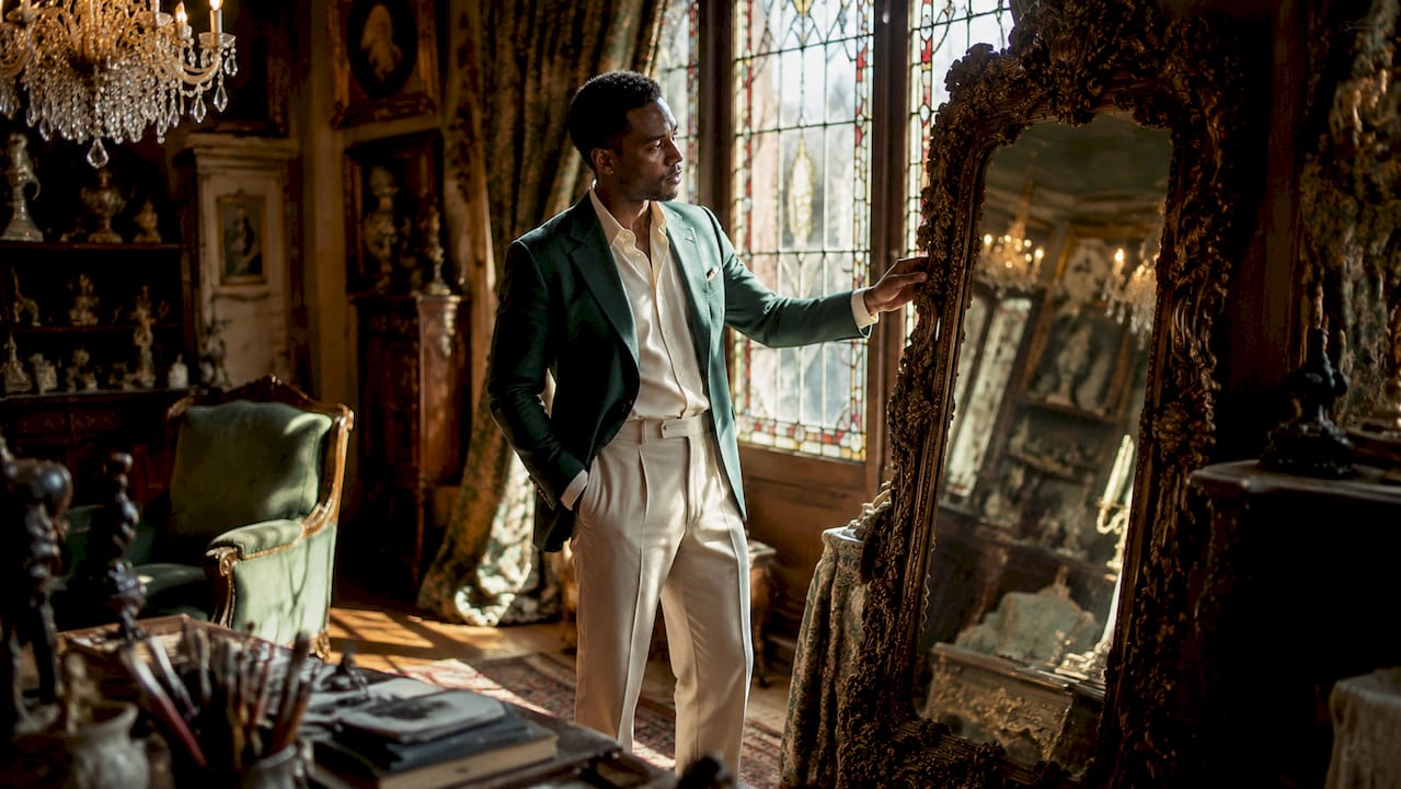 Interior designer inspecting antique Georgian desk in showroom