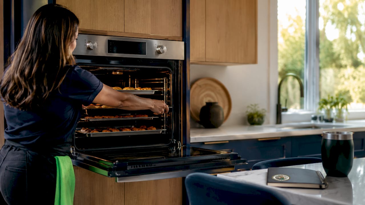 Side-hinged wall oven opened in accessible kitchen