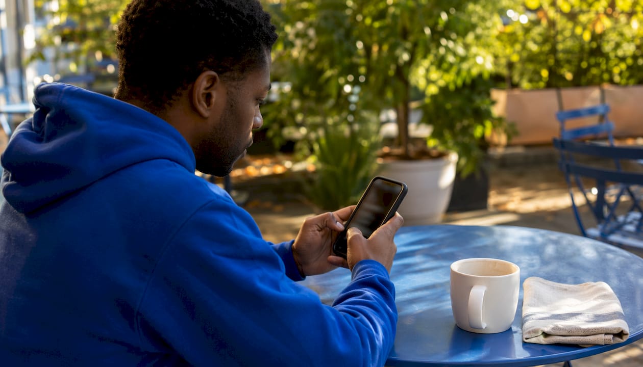Customer typing on phone live chat