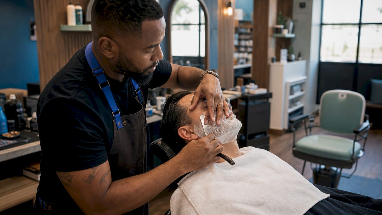Close-up straight razor shave in men's grooming