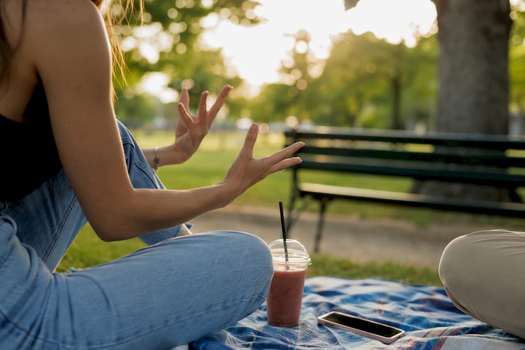 Expressive hands conveying tone in conversation
