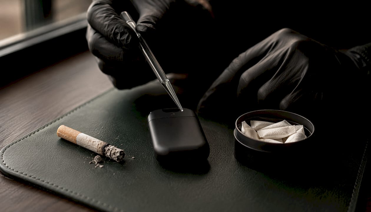 Top view of cigarette, vape device, oral nicotine pouches