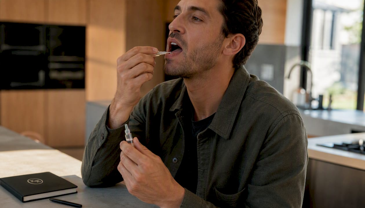 Close-up of hands preparing nicotine gel application