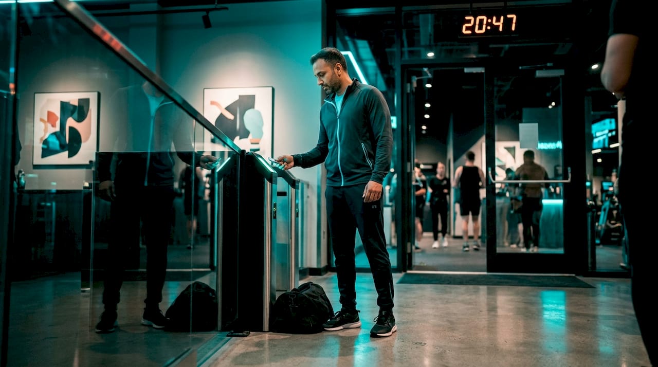 Man using key fob to enter gym after hours
