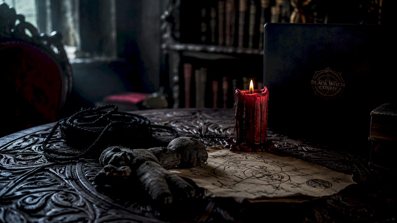 Close-up of binding spell tools on rustic table