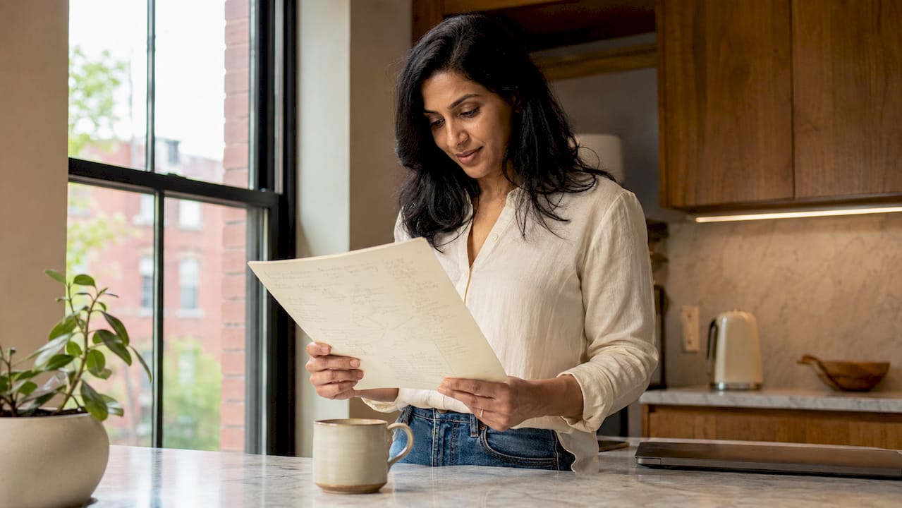 Coach planning online business at home desk