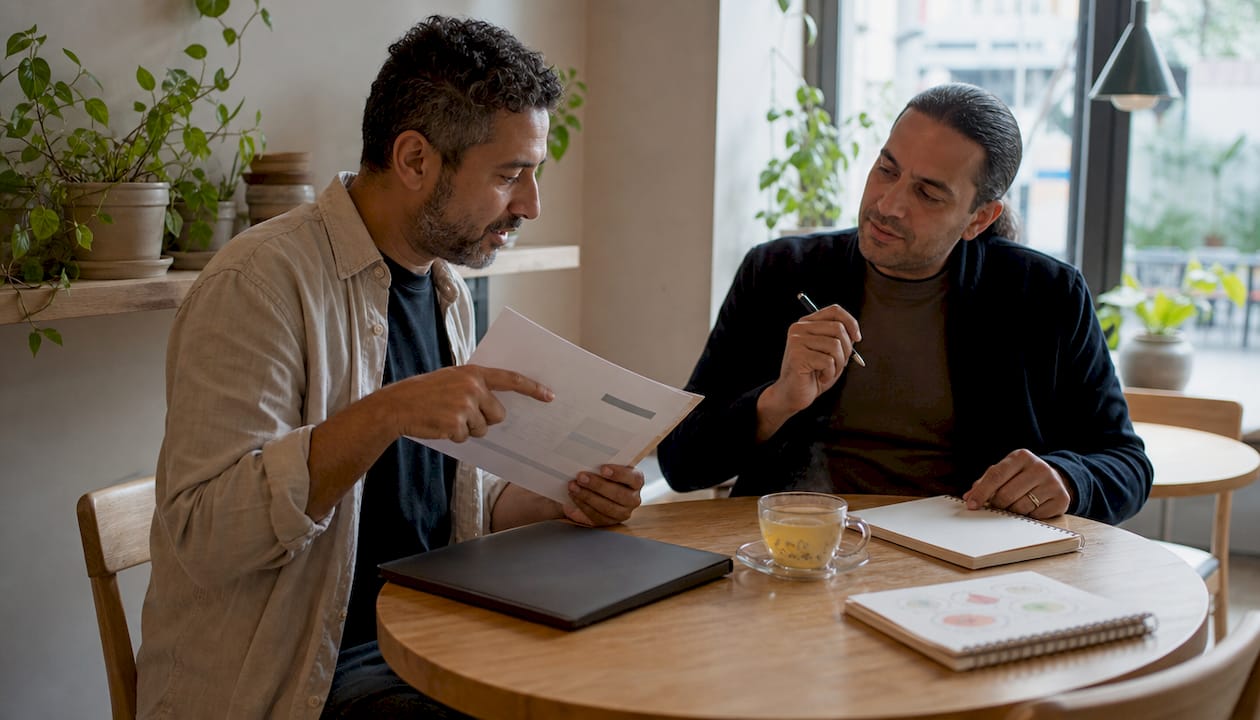 two men discussing small business website budget