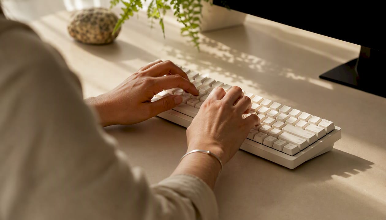 Hands using keyboard for navigation
