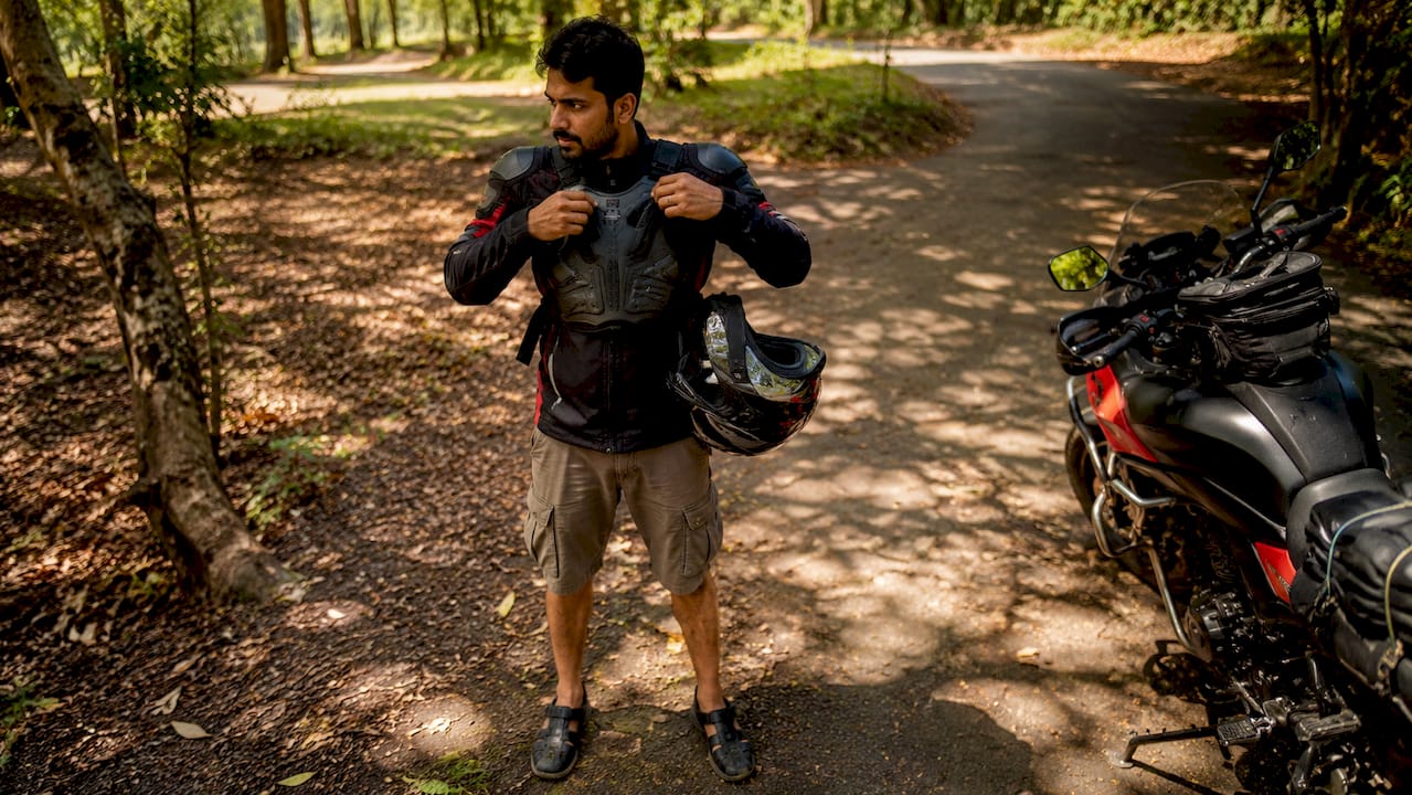 Motorcyclist wearing chest protector outdoors