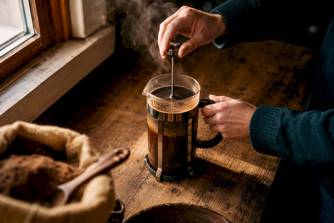 French press brewing mushroom coffee