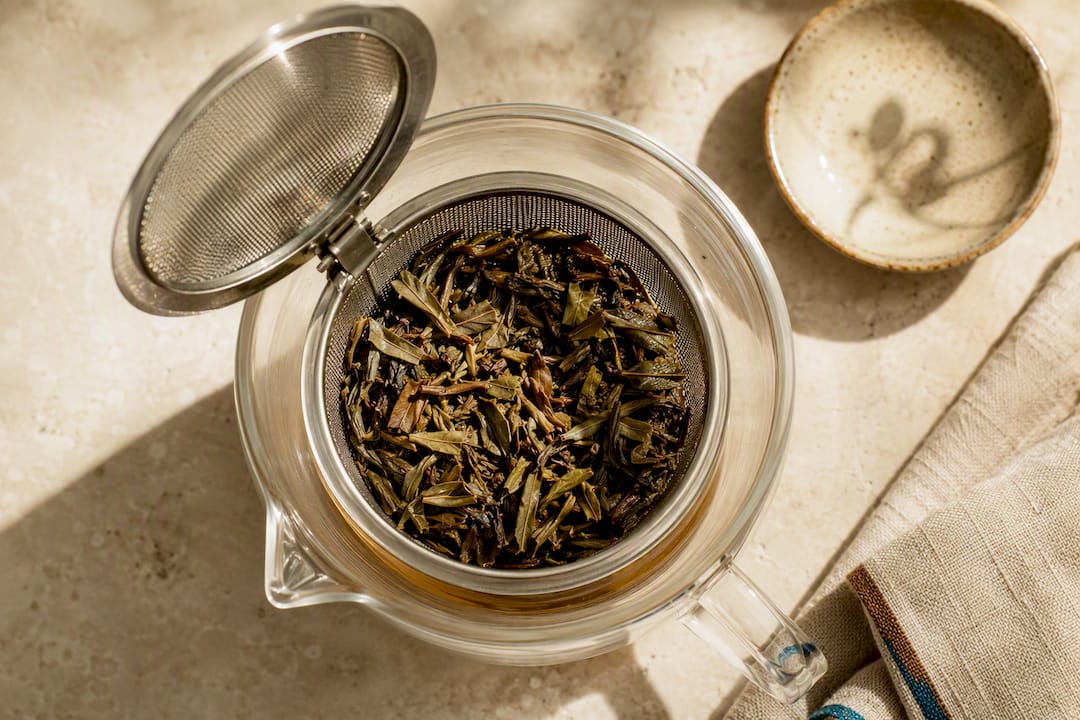 Expanded tea leaves inside roomy infuser