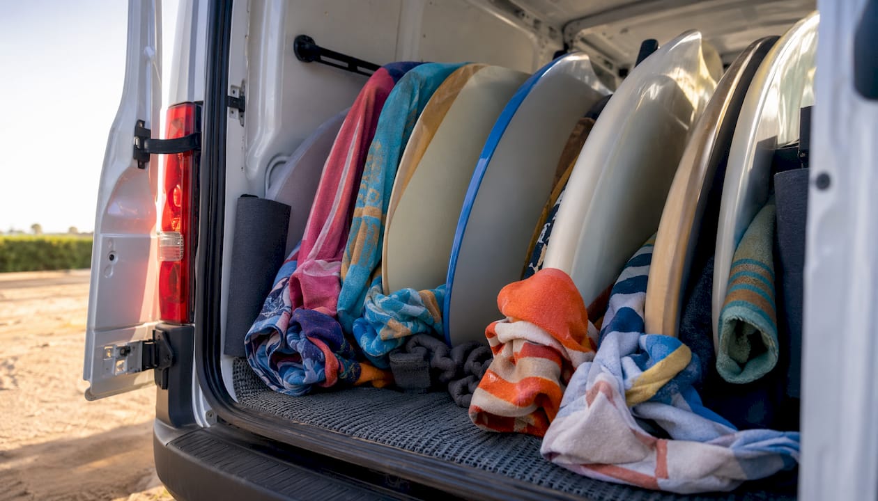 Stacked surfboards with padding inside van