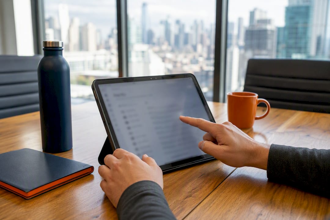 Hands holding tablet with passenger manifest