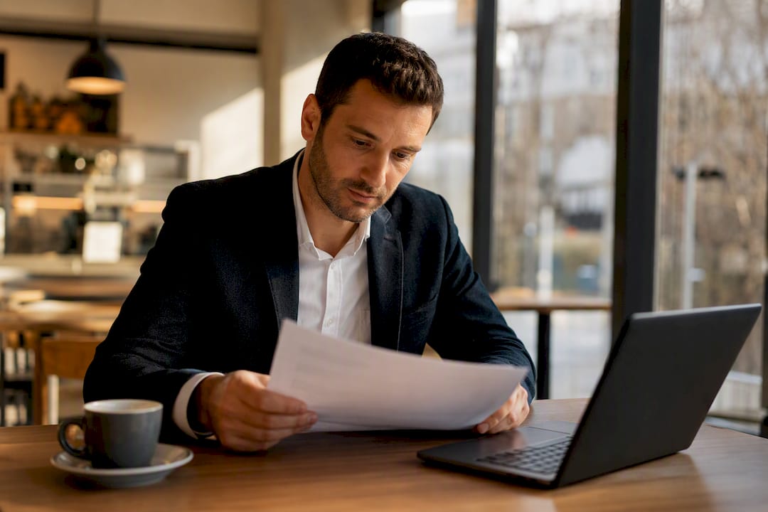 Contract and glasses on desk