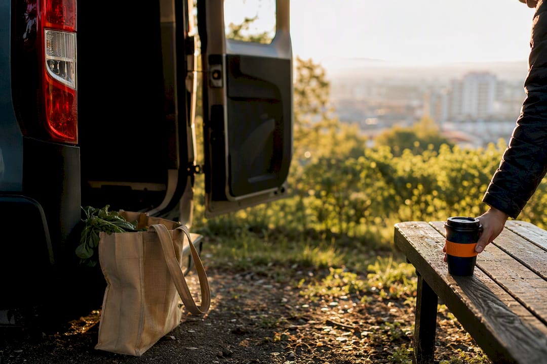 Van cargo area with reusable shopping bag outdoors