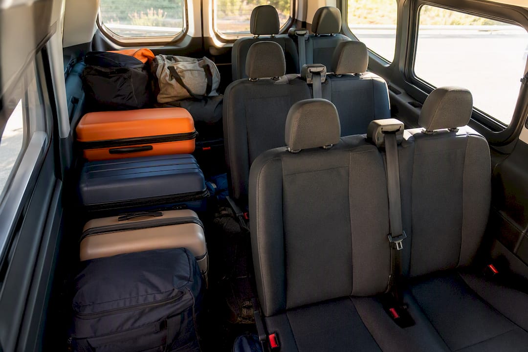 Packed luggage arranged inside van interior