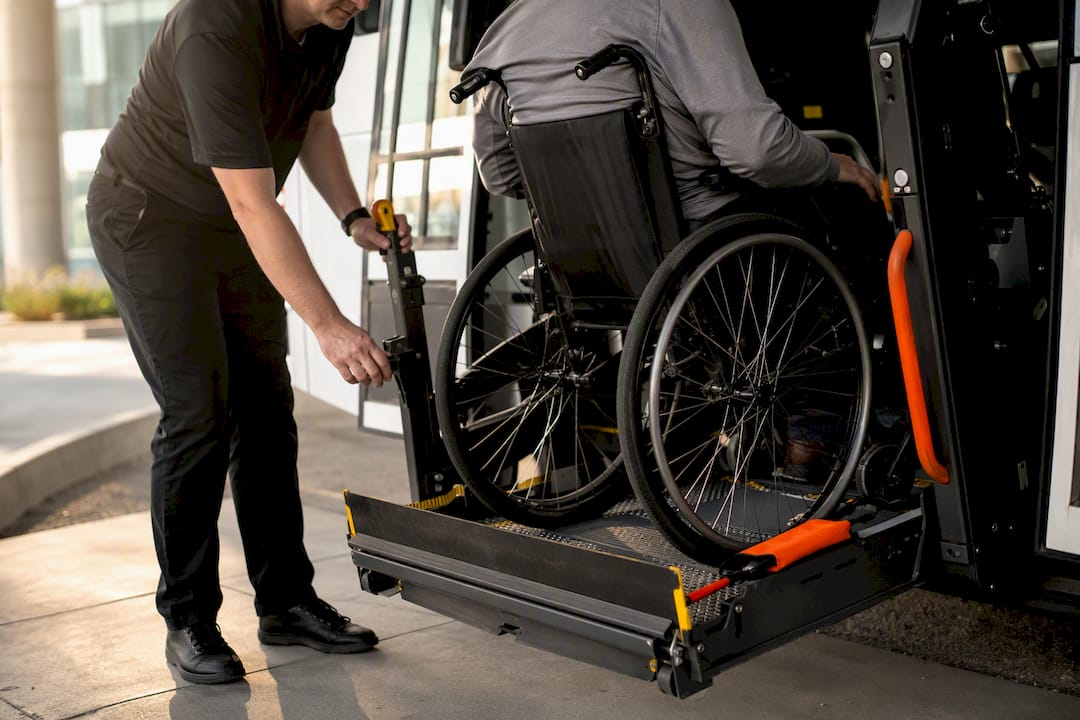 Wheelchair boarding an accessible shuttle lift