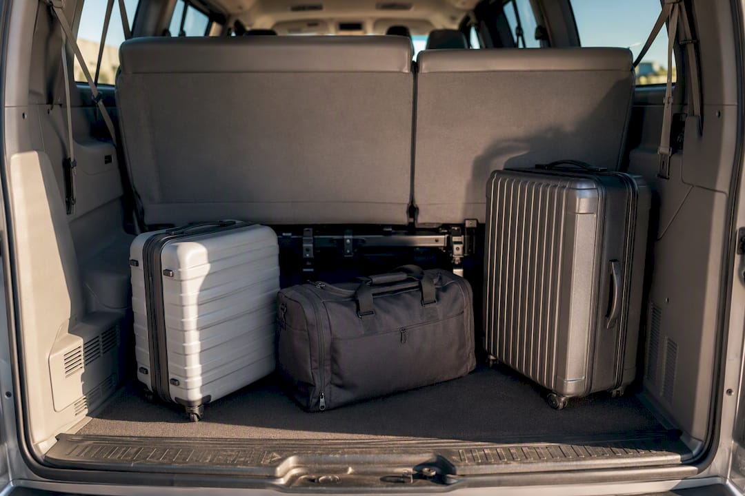Luggage beside a partially removed van bench