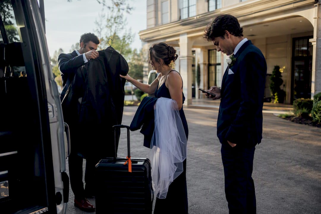 Wedding party preparing for group transportation